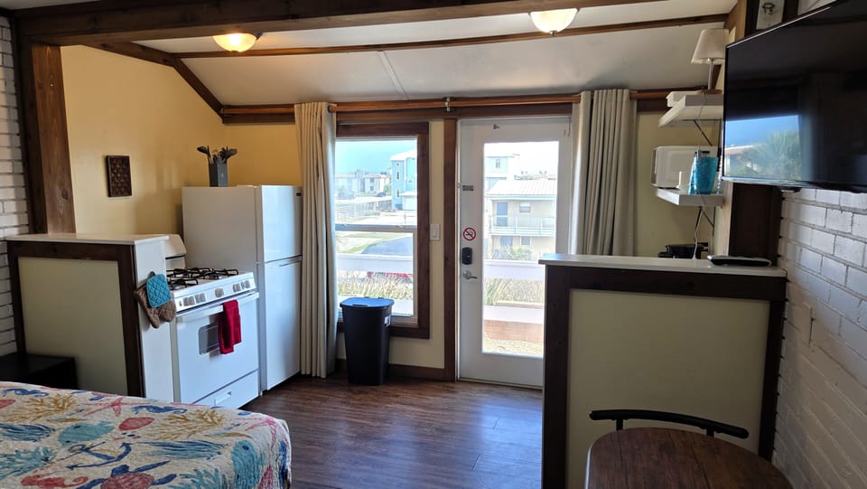The studio has a full kitchen with views of the ocean.