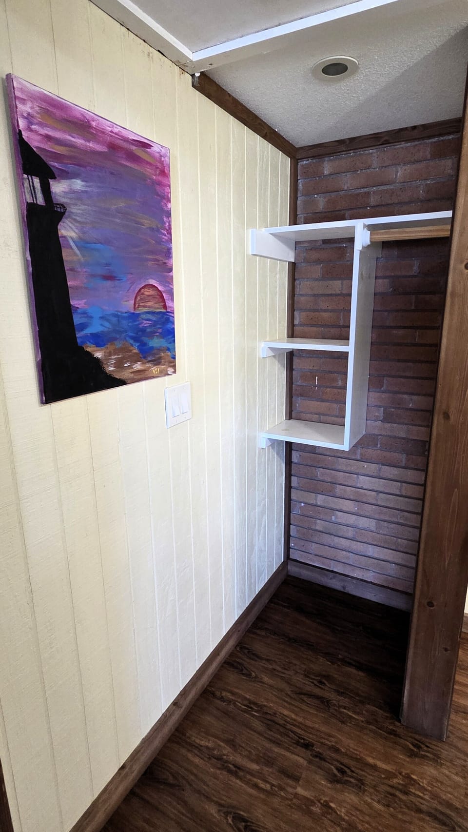The bathroom also has a small closet for storage.
