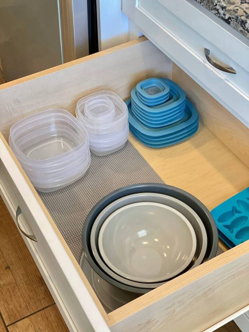 The unit has a small kitchenette with tupperware, dinnerware, silverware, pot/pan for the two-burner hot plate, Kuerig and drinking glasses.