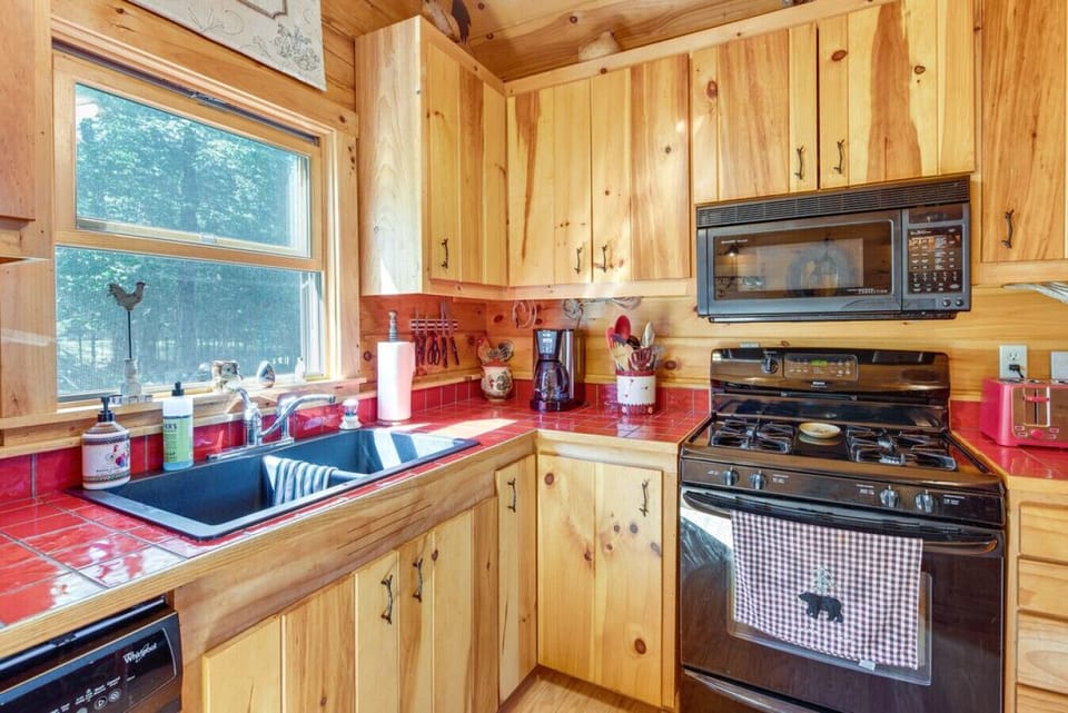 Fully equipped kitchen with gas range and bright window