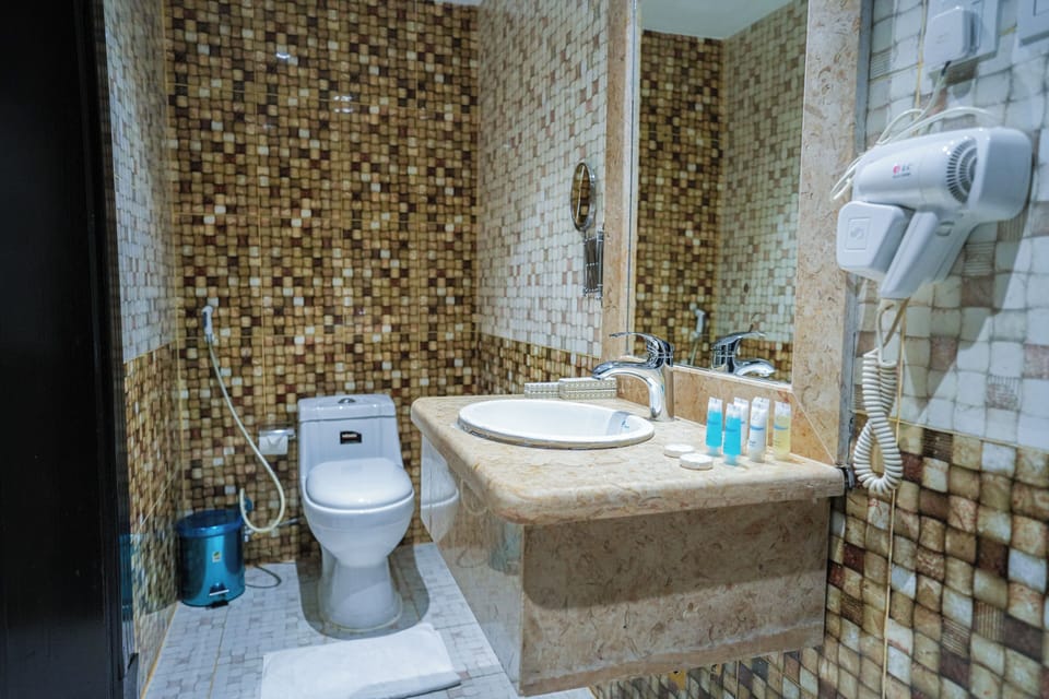 Hair dryer, slippers, towels, soap