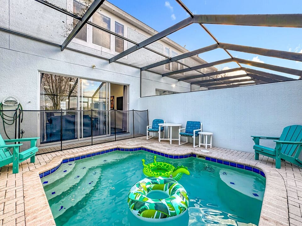 Private Screened Pool & Patio — Enjoy your own screened-in pool with outdoor seating, perfect for unwinding after a day at the parks.