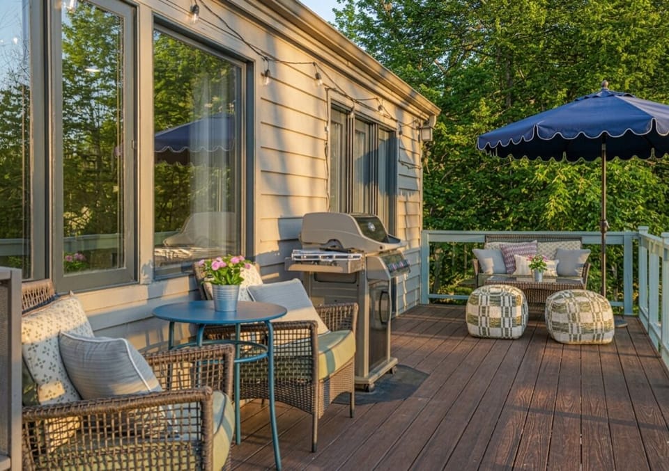 Stretching the width of the home, the upper deck offers endless ways to linger.