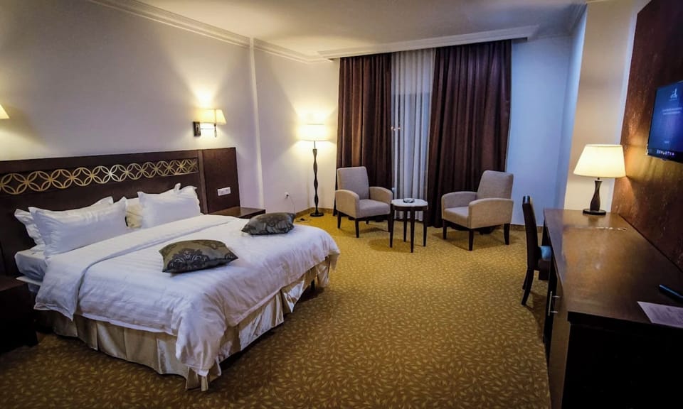 Standard Double or Twin Room | Minibar, in-room safe, desk, laptop workspace