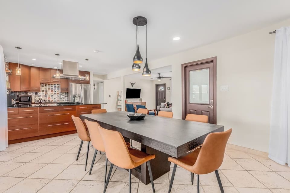 Spacious dining table conveniently located next to the kitchen