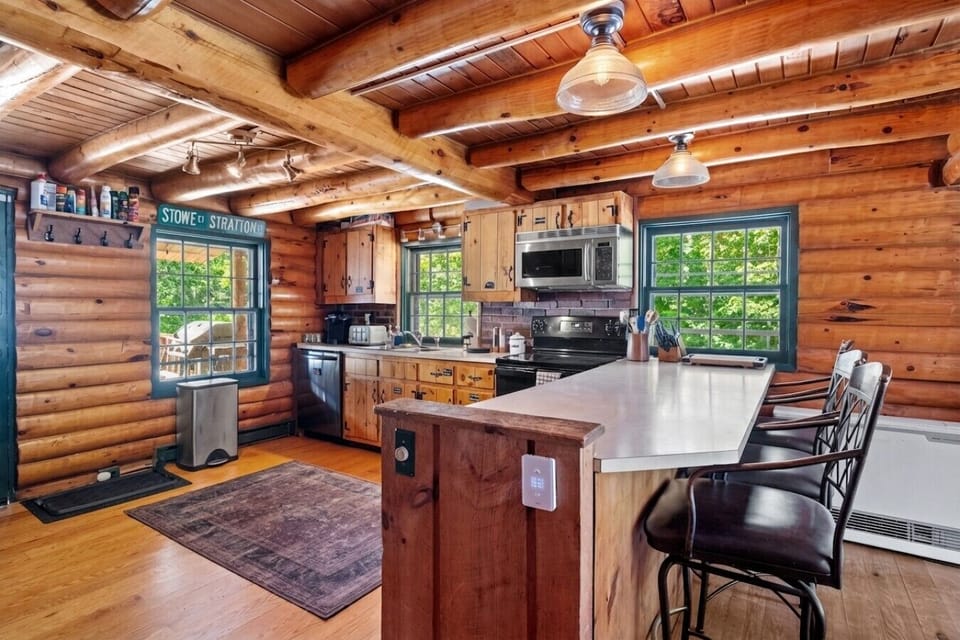 Enjoy the beautiful view to the woods from every corner while cooking dinner!