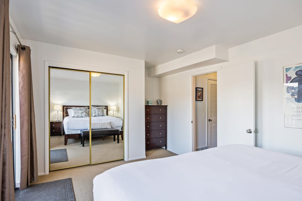 Spacious and inviting bedroom with a king bed, ample storage, and a peaceful layout designed for restful nights.