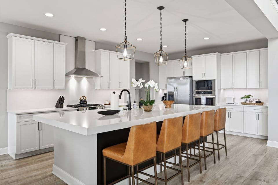 Beautifully equipped kitchen with spacious island, gas range, dishwasher, and combination drip-style and Keurig coffee maker