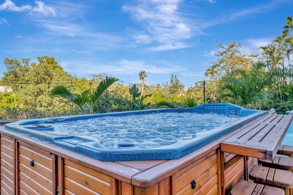 Private hot tub surrounded by tropical greenery