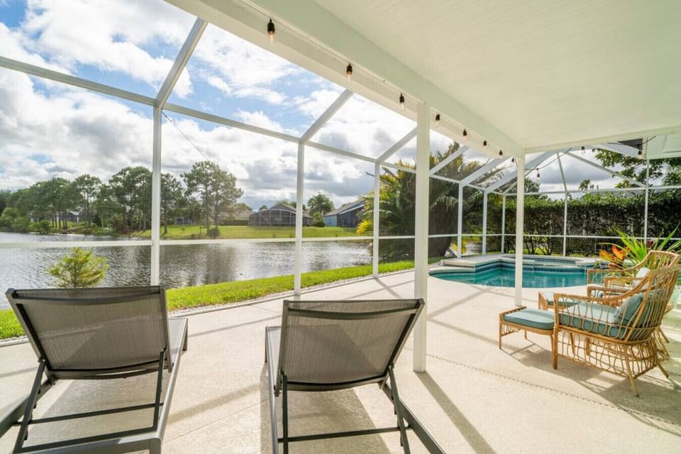 Lakefront lanai with lounge chairs.