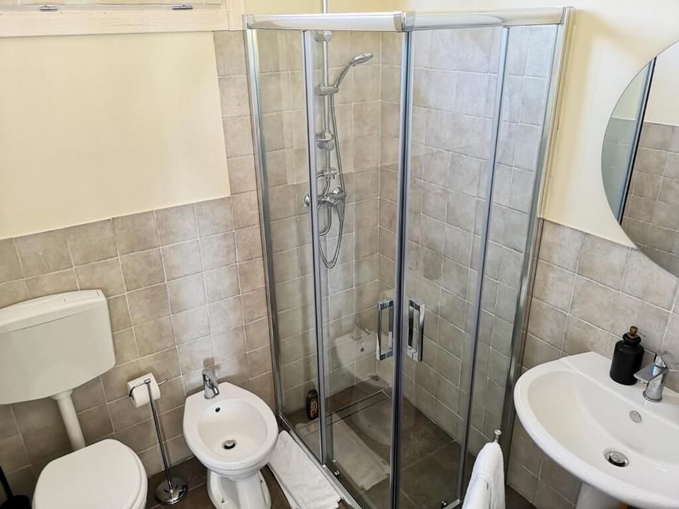 Junior Quadruple Room, Patio, Garden View | Bathroom | Shower, free toiletries, hair dryer, bathrobes