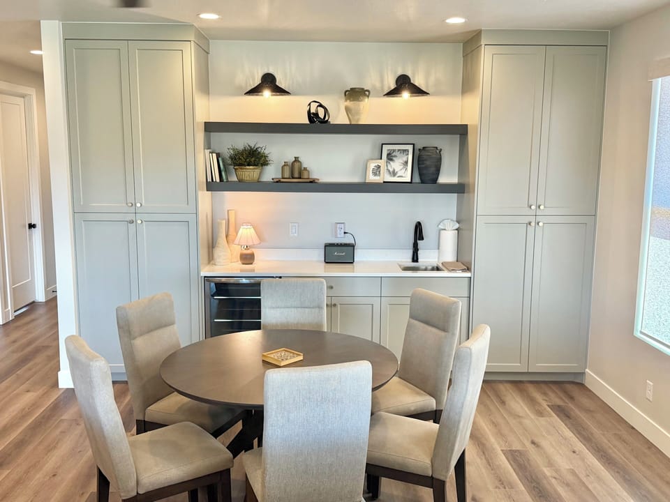 Upstairs kitchenette and gaming table with board games and card games.