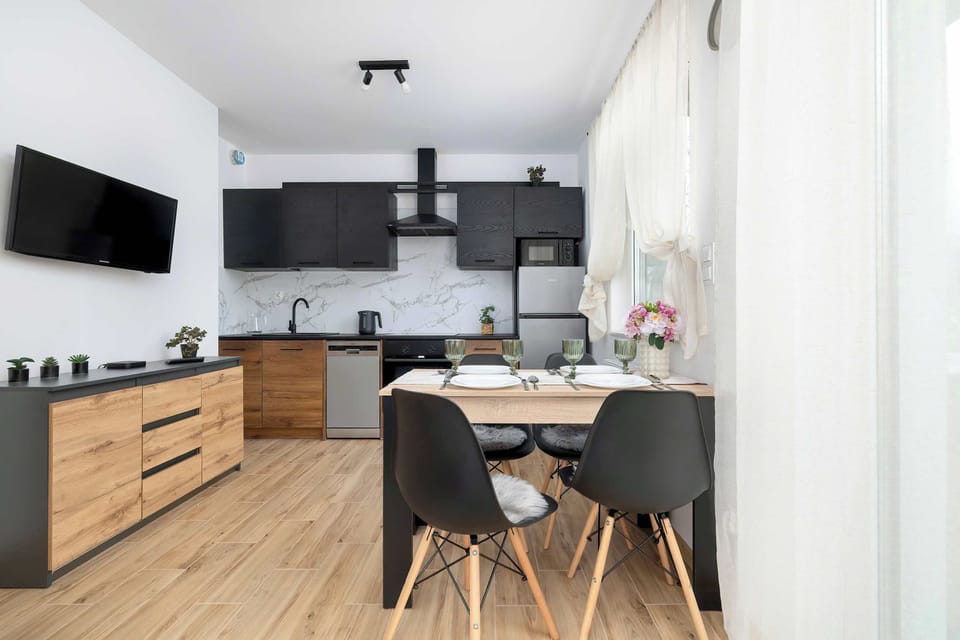 The living room's modern and stylish decor creates a welcoming atmosphere.
