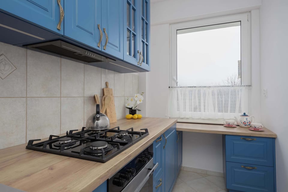 The kitchen with a bright worktop and good natural light makes everyday cooking comfortable.