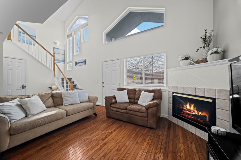 Comfortable lounge area with fireplace and plenty of natural light