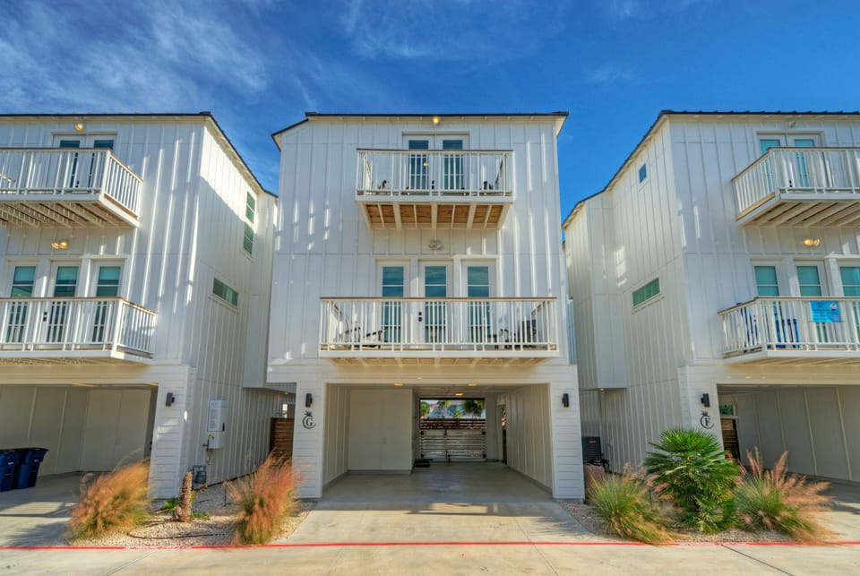 Modern three-story coastal home exterior.