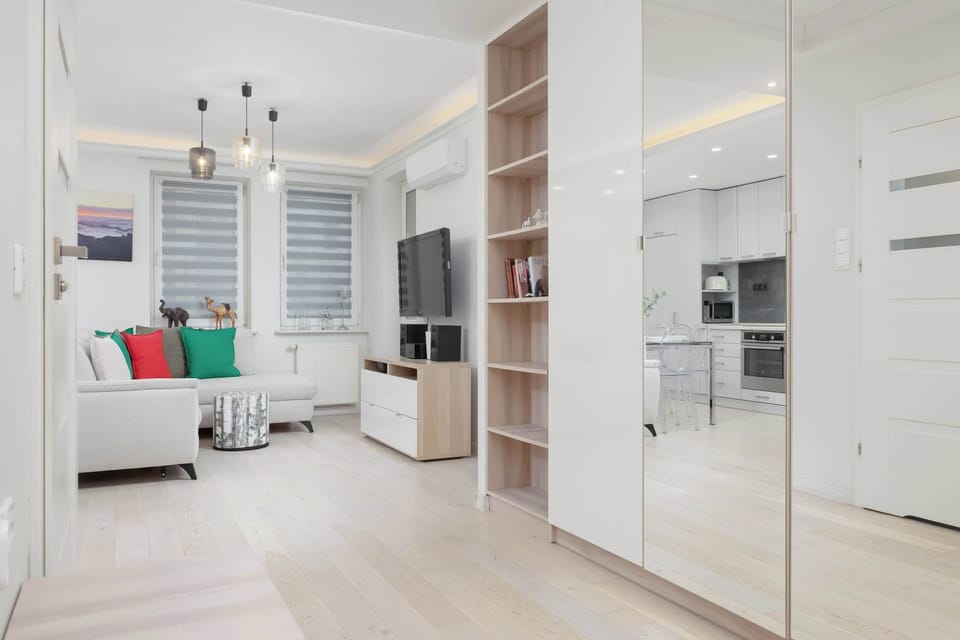 The living room's modern and stylish decor creates a welcoming atmosphere.