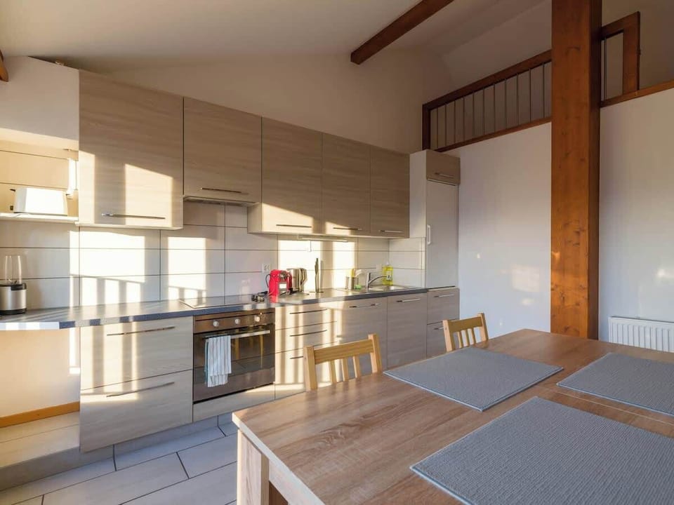 Cozy sleeping area under the roof with two single beds
