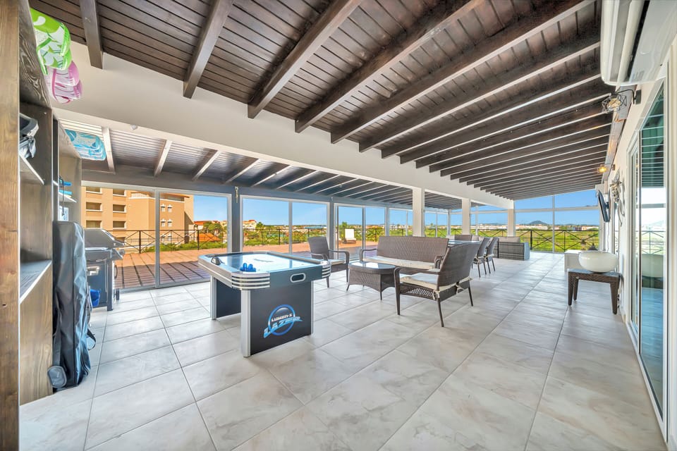 Spacious private balcony with air hockey table