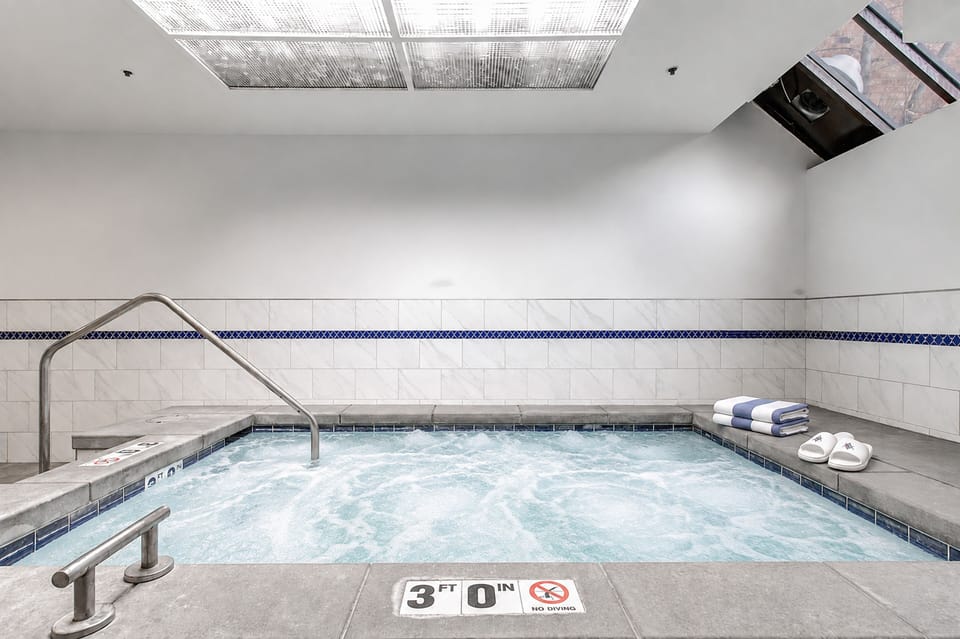 Take a refreshing dip in the indoor hot tub, perfect for year-round relaxation.