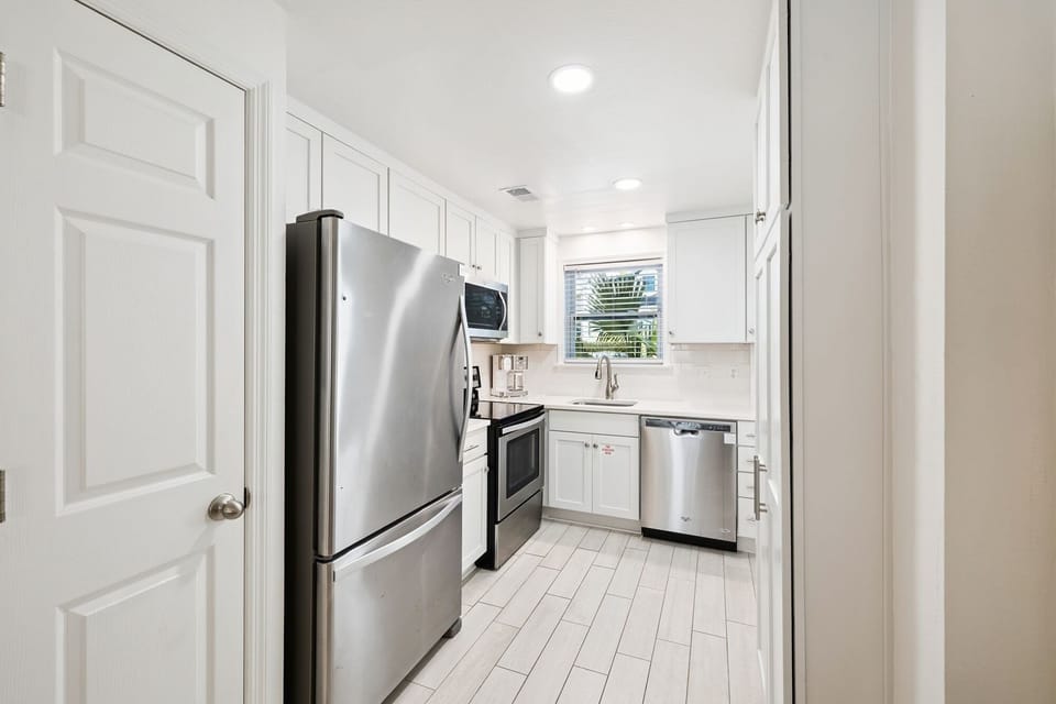 Your bright, fully-equipped kitchen features stainless steel appliances and ample counter space for creating memorable meals during your stay.
