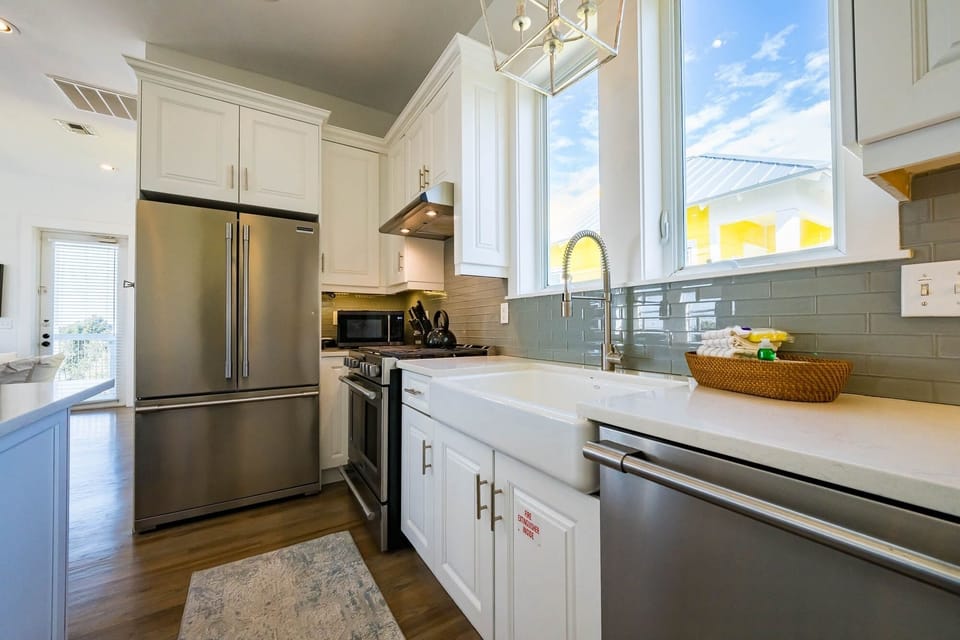 Your fully equipped kitchen awaits with gleaming stainless steel appliances, quartz countertops, and everything needed to create memorable meals during your stay.