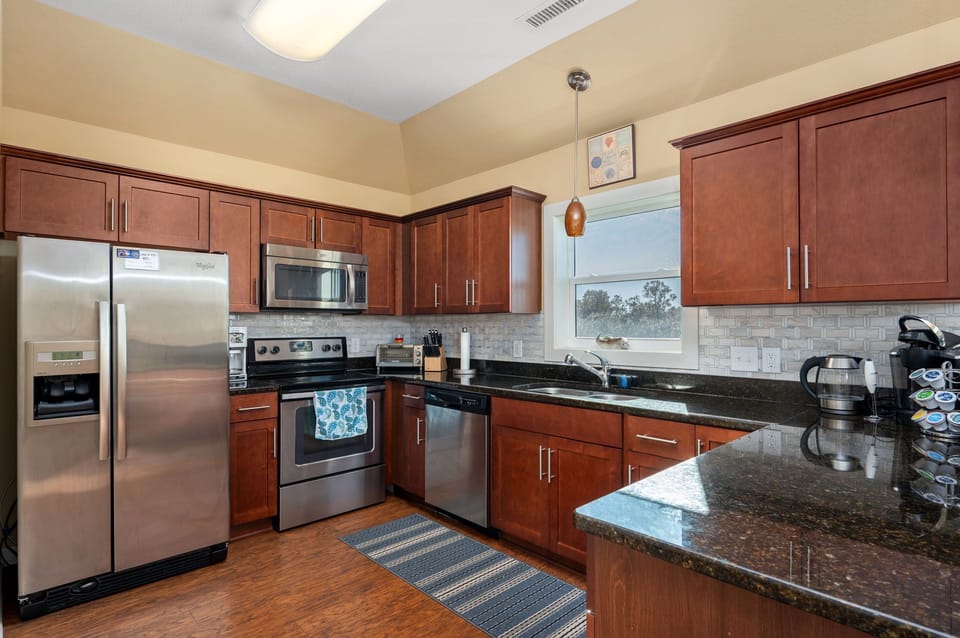 Beach House Kitchen Filled with Natural Light & Airy Colors, and Relaxed Costal Charms