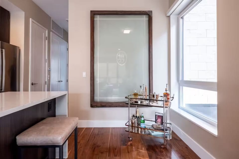 An original windowpane from the iconic J.L. Hudson Building adorns the wall