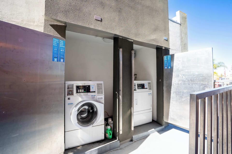 Laundry area with full-size washer and dryer—perfect for extended stays or beach-day cleanup.