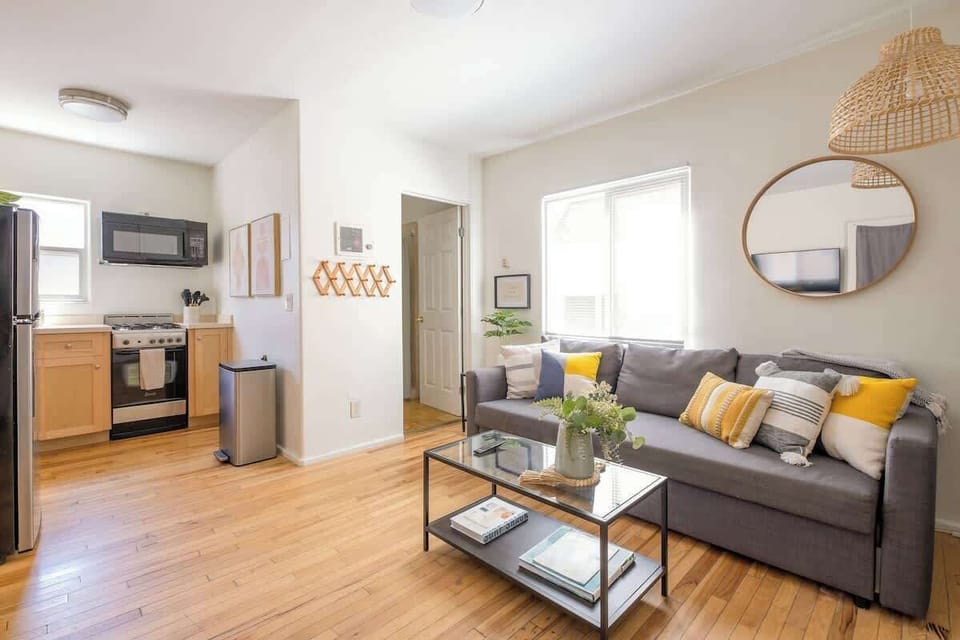 The living area doubles as a second sleeping space with a pull-out sofa bed