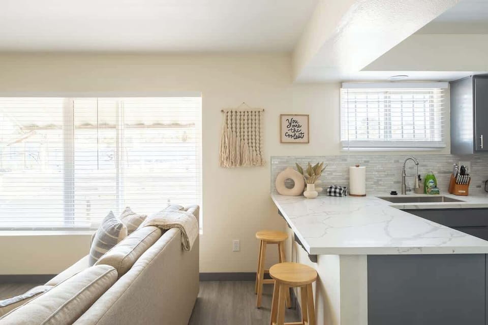 The apartment is filled with natural light from its walls of windows