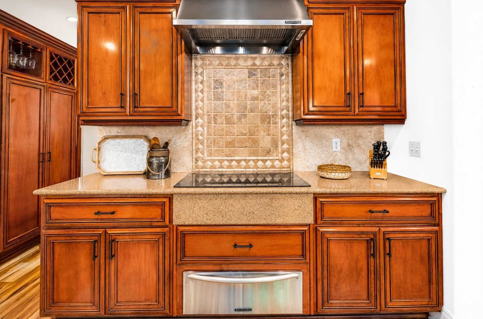 Induction cooktop with warming drawer below. 