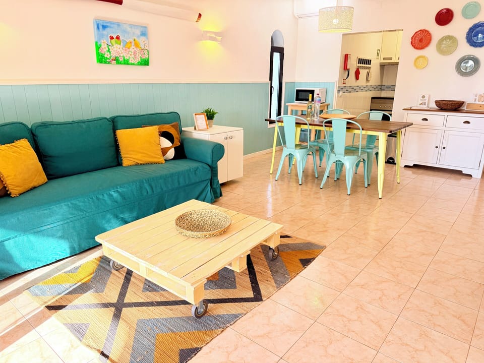 Living room with sofa bed that sleeps 2. Dining Table. Kitchen. TV. Free WiFi.