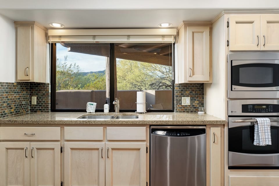 Bright, modern kitchen overlooking the patio.