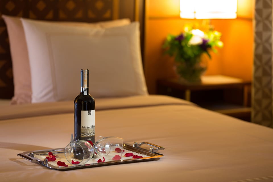 Deluxe Room, Balcony, City View | Minibar, in-room safe, desk, laptop workspace