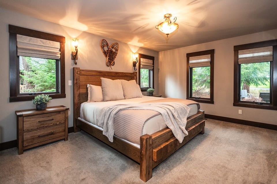 Primary bedroom retreat with handcrafted wood details and hotel-worthy comfort.