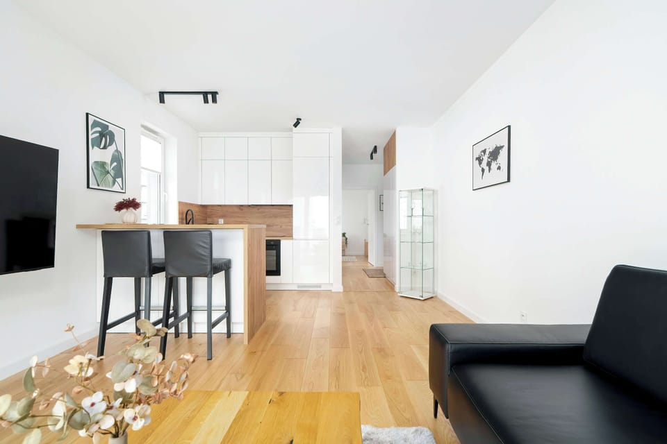 The living room's modern and stylish decor creates a welcoming atmosphere.