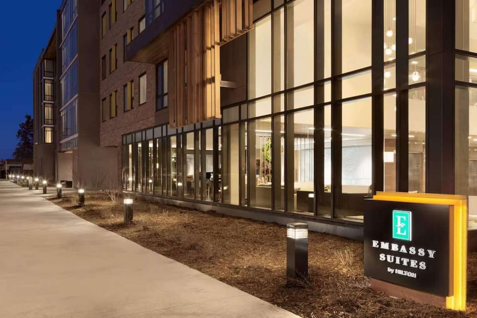Night view of entrance with glass walls and bright lights