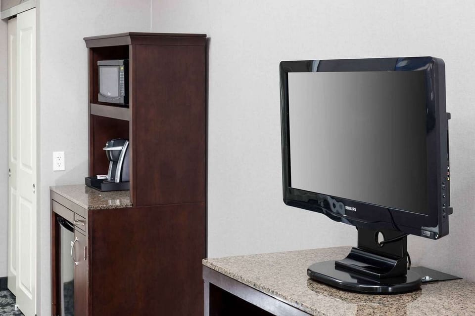 Flat-screen TV with dresser and coffee station