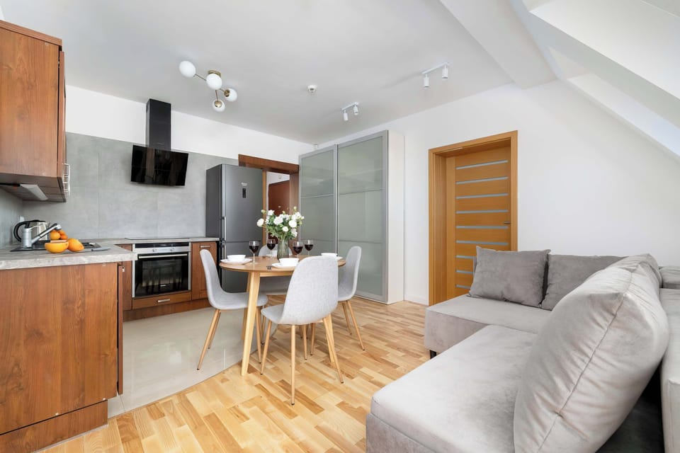 Living area connected to the kitchen and dining zone.