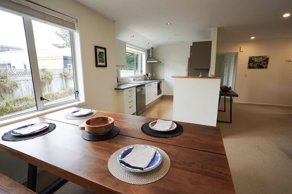 Dining room table and kitchen.