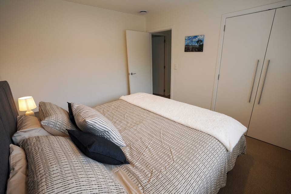 King-sized bed in the second bedroom with a full-sized closet.