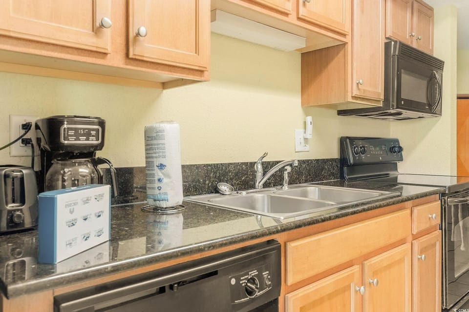 Kitchen includes access to a coffee maker, toaster, microwave, oven and more.