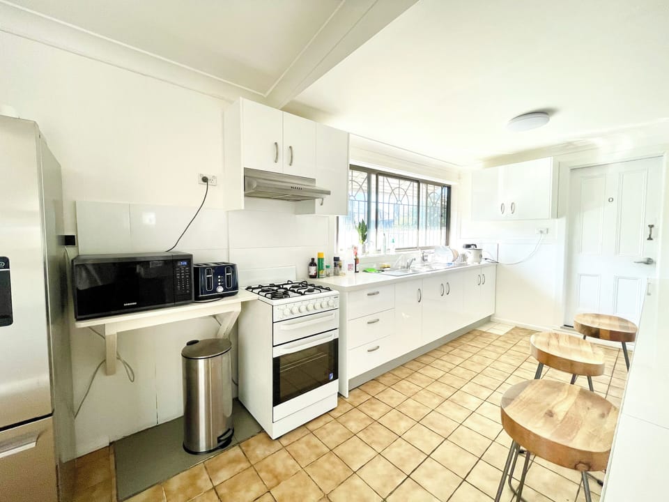 Full-size fridge, microwave, oven, cookware/dishes/utensils