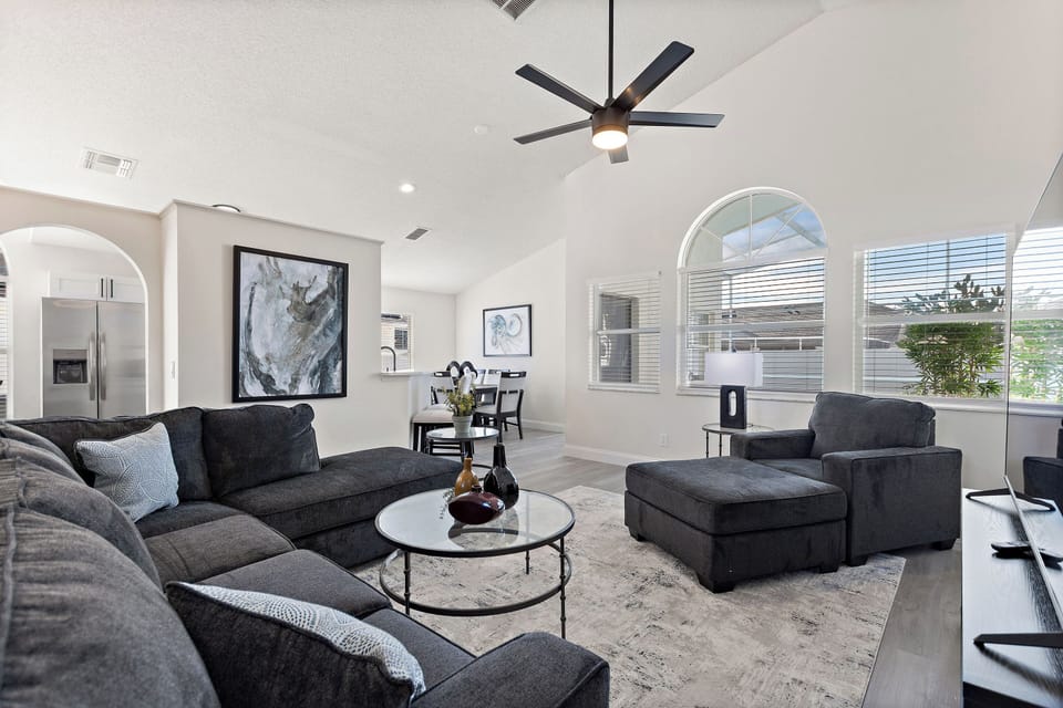 Modern living room with sectional sofa and accent chairs
