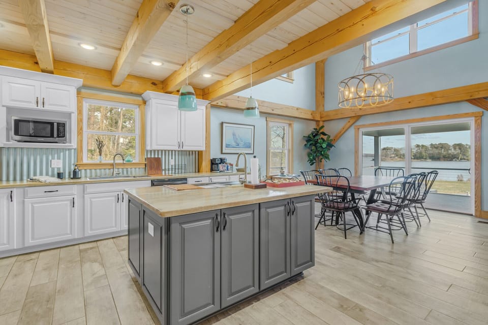 Gourmet kitchen with a large island connects to the dining area