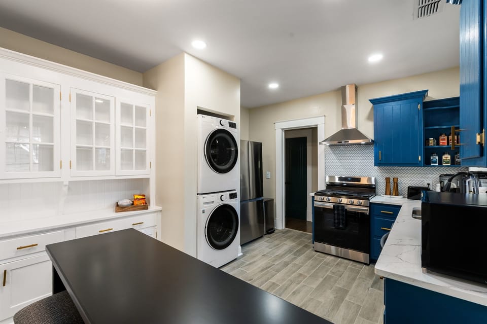 Spacious Chef's Kitchen. Fully stocked with everything you need to create fabulous meals. Enjoy breakfast on the counter bar, watch your favorite cooking show on the 50" Smart TV, also includes full size washer/dryer.