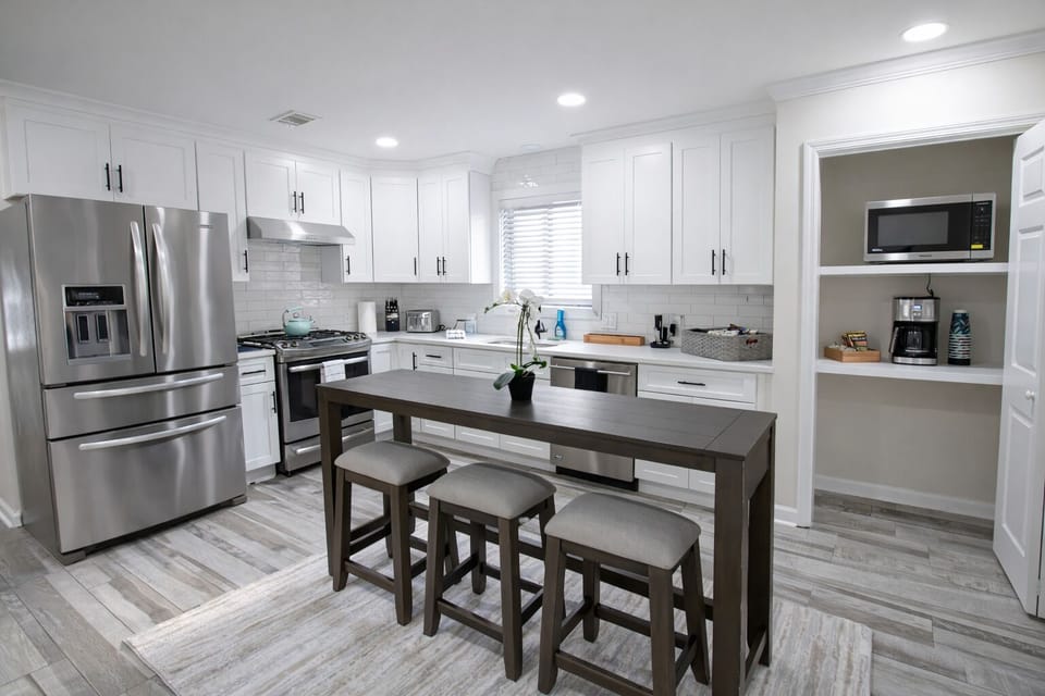 Chef's Kitchen complete with Stainless Appliances, Gas Range, Quartz Countertops, Fully equipped and ready for cooking fabulous meals.