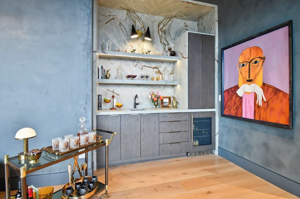 Step into your stylish kitchen where marble backsplash meets modern design, perfect for crafting memorable meals during your stay.