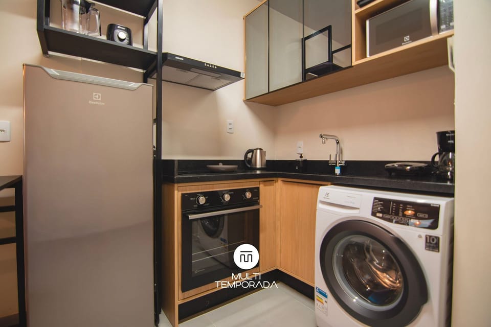 Premium Apartment, Pool Access | Private kitchen | Fridge, microwave, cookware/dishes/utensils, dining tables